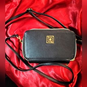 Liz Clairborne crossbody bag with phone charging power bank attached inside
